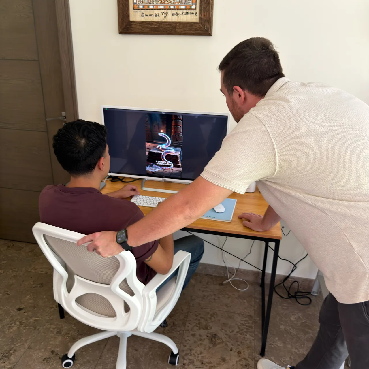 Discovery Marketing reviewing paid-ad creative on screen.
