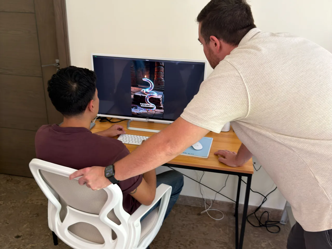 Discovery Marketing reviewing paid-ad creative on screen.