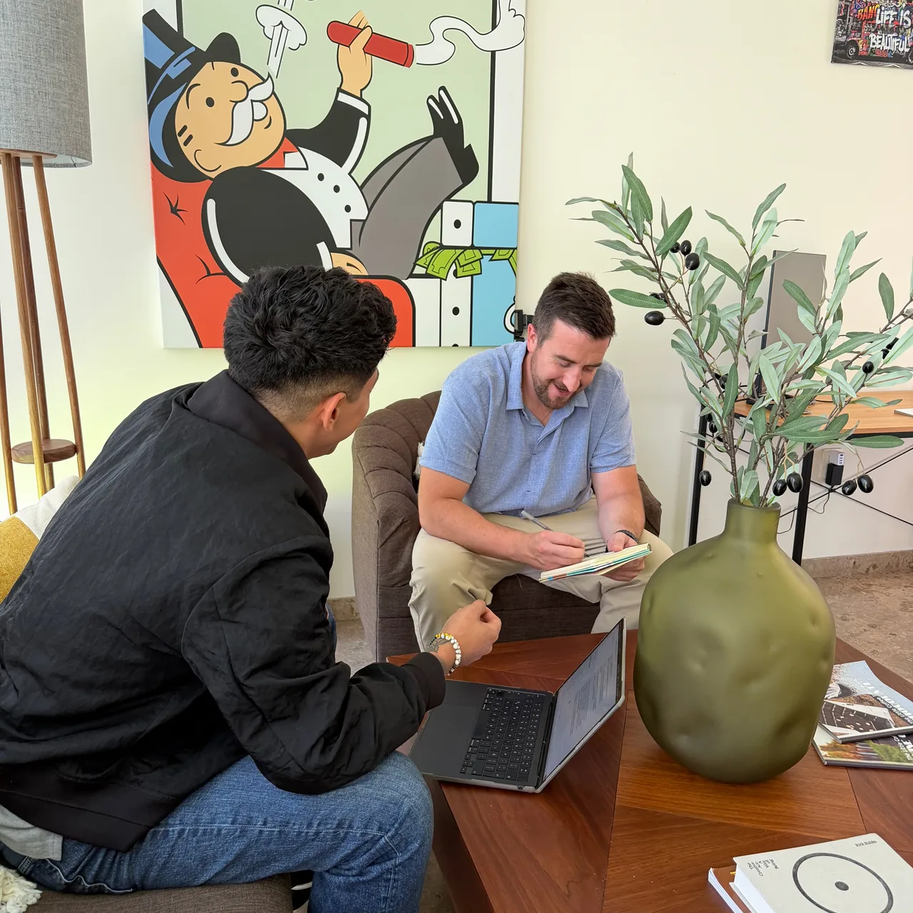 Andy Bedell taking notes during a Discovery Marketing strategy conversation.