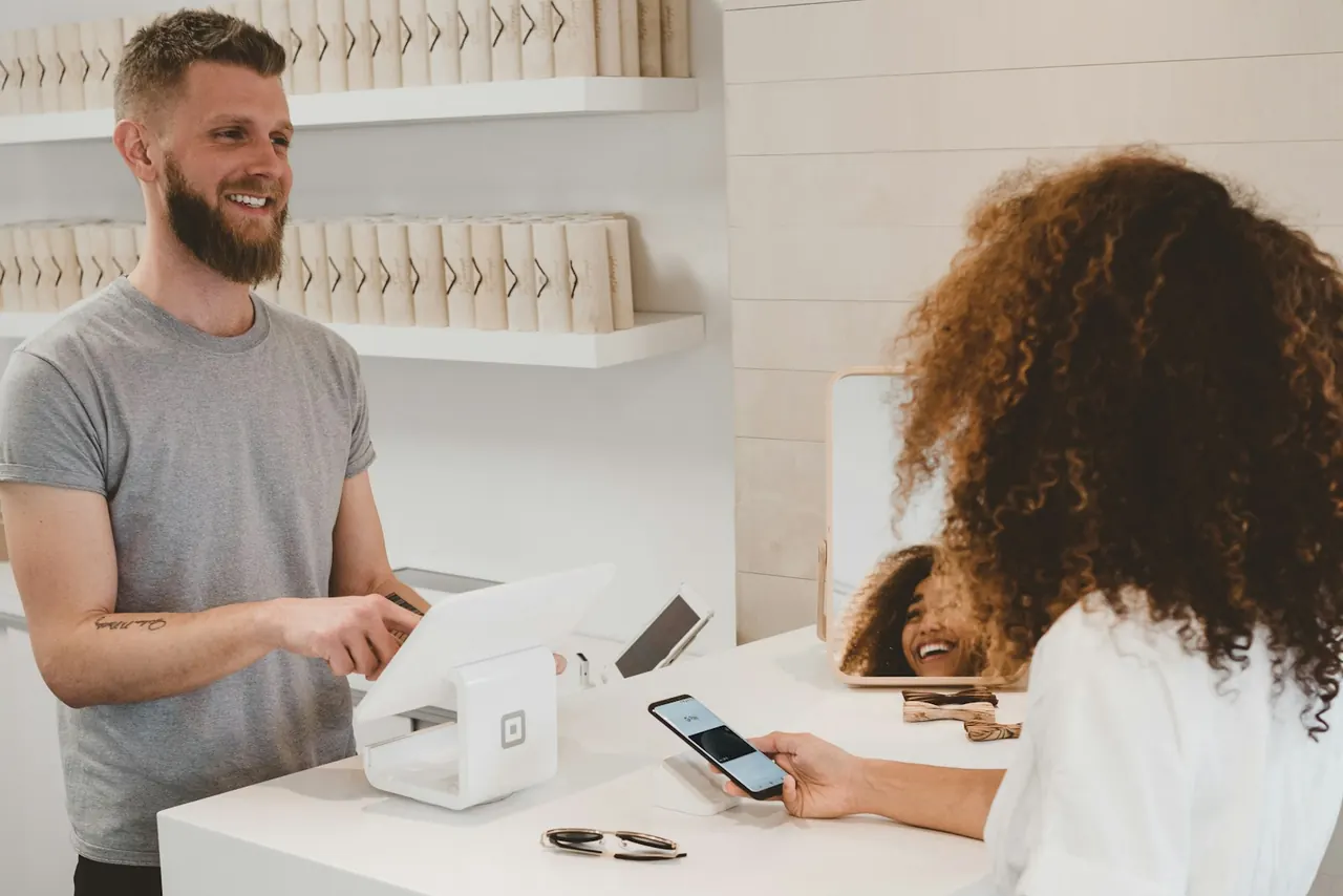A customer completing a digital purchase, representing the moment product interest becomes revenue.