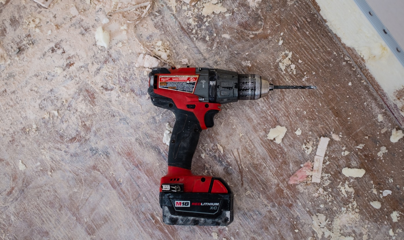 Cordless drill on a work surface during a home repair project