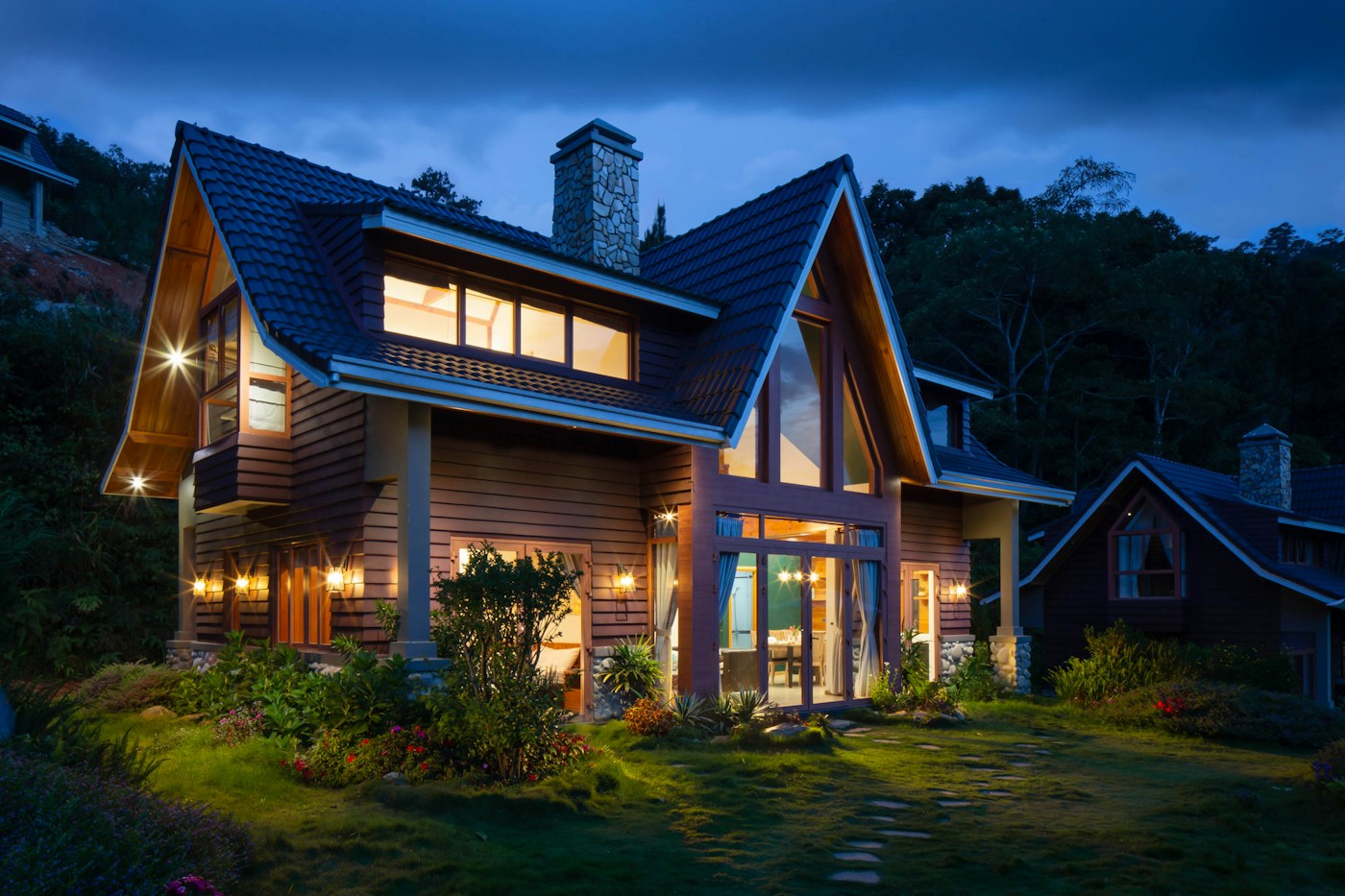Suburban home with a pitched roof and a landscaped front yard